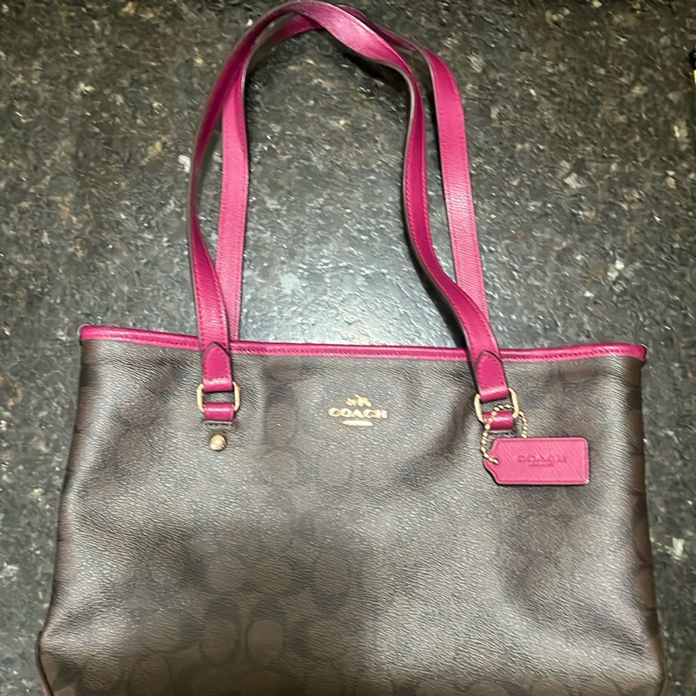 Coach small tote style purse brown with fuchsia accents.